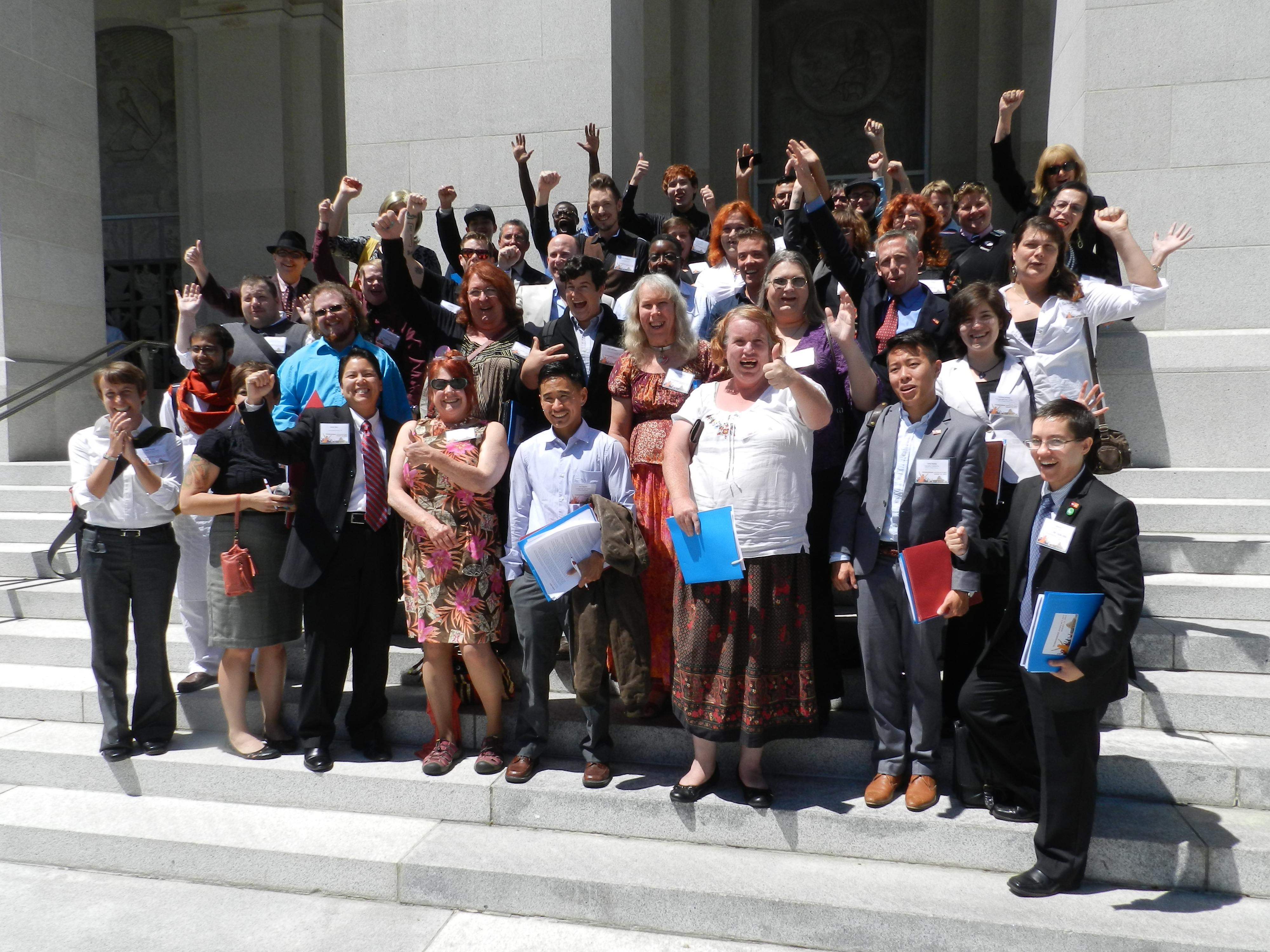 Image: Approximately 50 California Transgender Advocacy Day Citizen Lobbyists Cheering At The News Governor Brown Signed AB 1266 (The School Success and Opportunity Act) On August 12, 2013
